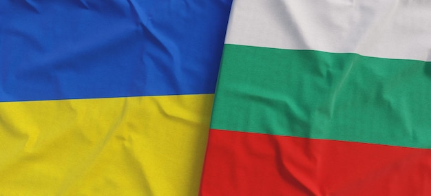 Flags of Ukraine and Bulgaria Linen flag closeup Flag made of cloth Ukrainian Kyiv Bulgarian Sofia National symbols 3d illustration