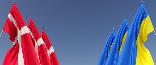 Флаги Украины и Дании на флагштоках по бокам Флаги на синем фоне Место для текста Независимая Украина Три флага Дании Европа 3D иллюстрация