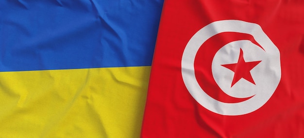 Flags of Ukraine and Tunisia Linen flag closeup Flag made of canvas Ukrainian Kyiv Tunisian Africa National symbols 3d illustration