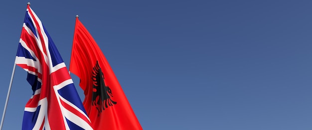 Bandiere del regno unito e dell'albania sui pennoni sul lato bandiere su sfondo blu gran bretagna inghilterra tirana illustrazione 3d