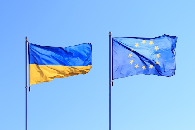 flags waving in the wind, two flags against the sky