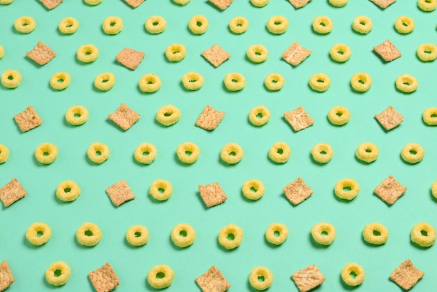 Flakes on a green wall.