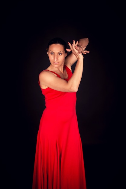 Flamenco woman in red dress and playing palms
