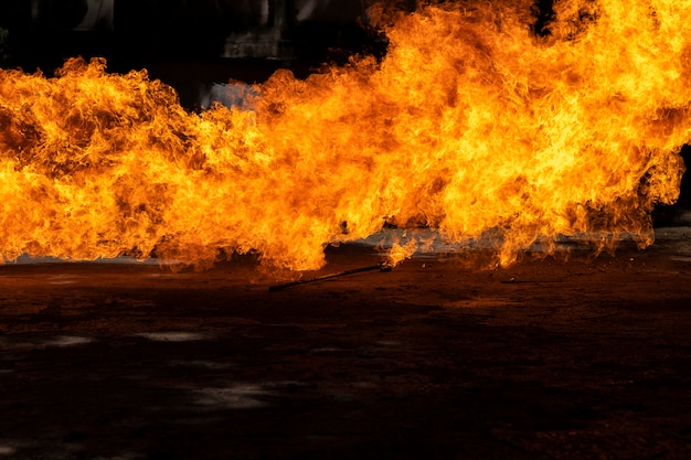 Flames caused by the explosion of the oil. Demonstration of water on oil fire.