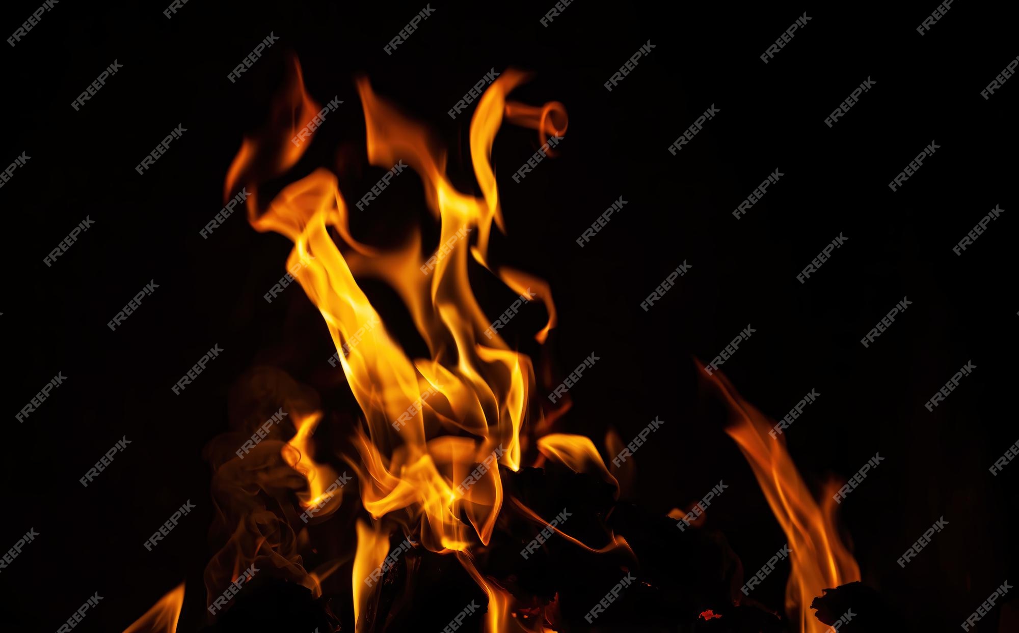 Premium Photo | Flames, fire background and texture. fireplace with wood  and fire on a dark background