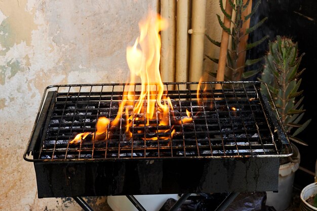 Flames fire with empty grill grid