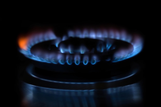 Flames of gas stove on the dark background