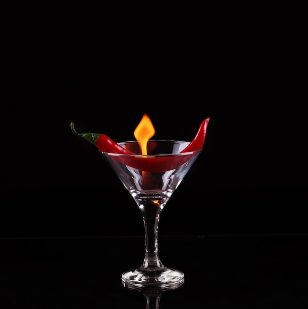 Flaming cocktail over black