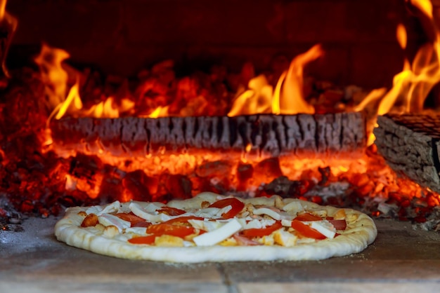 Flaming Hot Wood Fired Pizza Baking in Oven