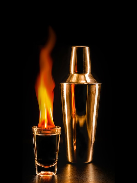 Flaming tequila, mexican drink served with fire, incandescent drink