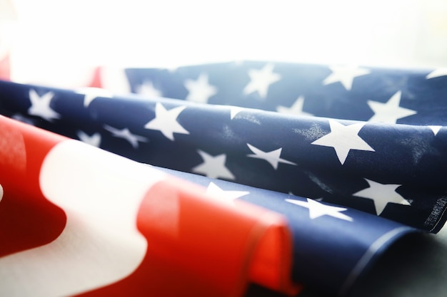 Flapping flag USA with wave. American flag for Memorial Day or 4th of July. Closeup of American flag on dark background