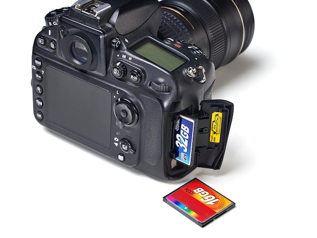 Flash card CF and DSLR camera isolated