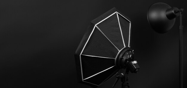 Photo flash light on tripod in studio production set up for professional photographer shooting photo