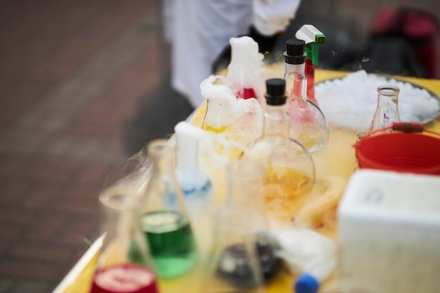 flasks with different reagents on the table chemical experiments