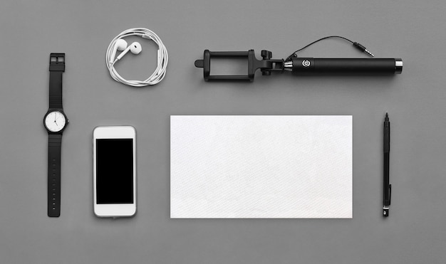 Flat lay of accessories on gray desk background of traveler, Voyage concept.