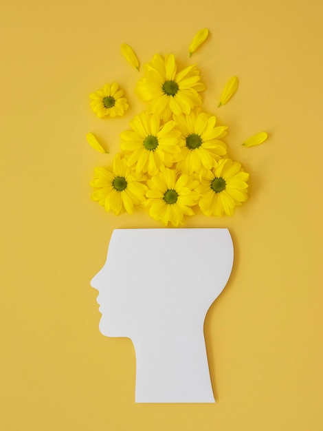 Photo flat lay arrangement of optimism concept with flowers