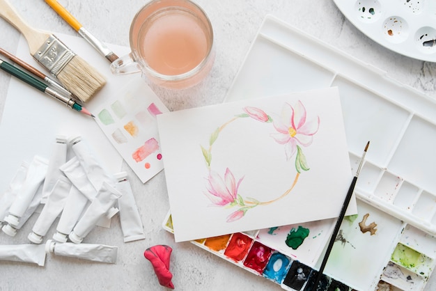 Photo flat lay arrangement with painting