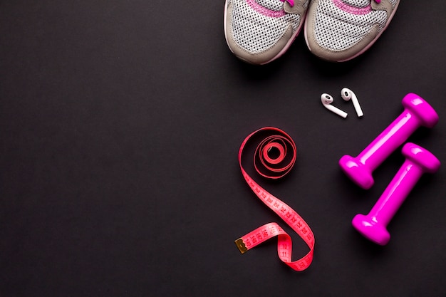 Photo flat lay arrangement with sports items and airpods