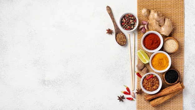 Photo flat lay asian food spices mix and chopsticks with copy space