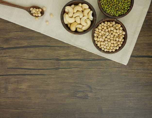 Flat lay assorted beans  on wooden table with copy space