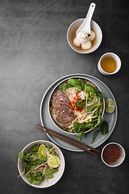 Photo flat lay of assortment of vietnamese food