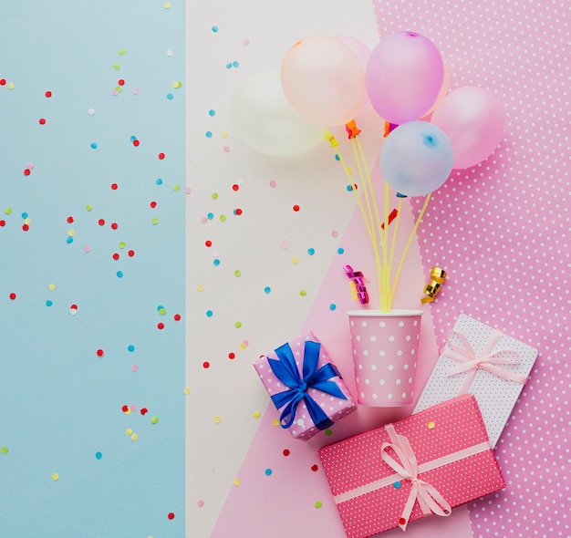 Photo flat lay assortment with balloons and gifts