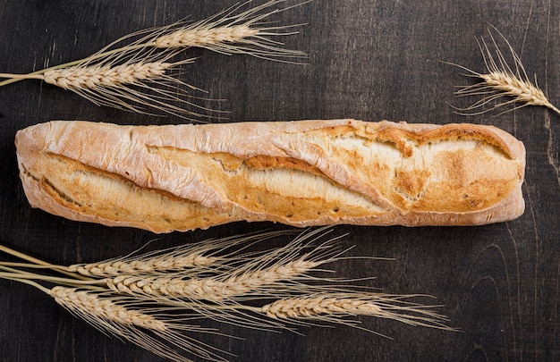 Flat lay baguette french bread with wheat