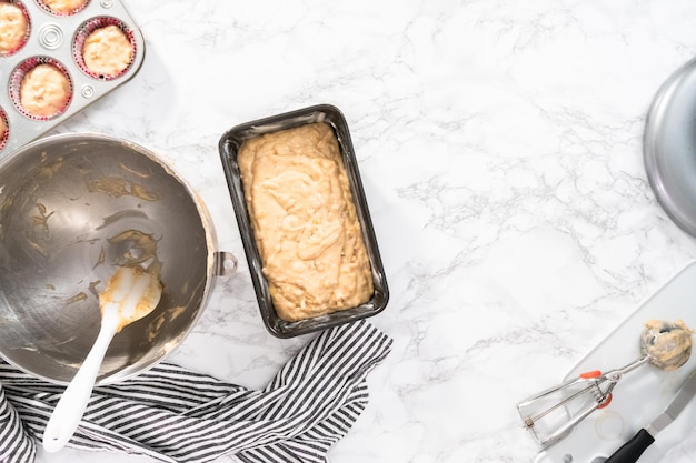 Photo flat lay. banana nut bread batter in the loaf pan before baking.