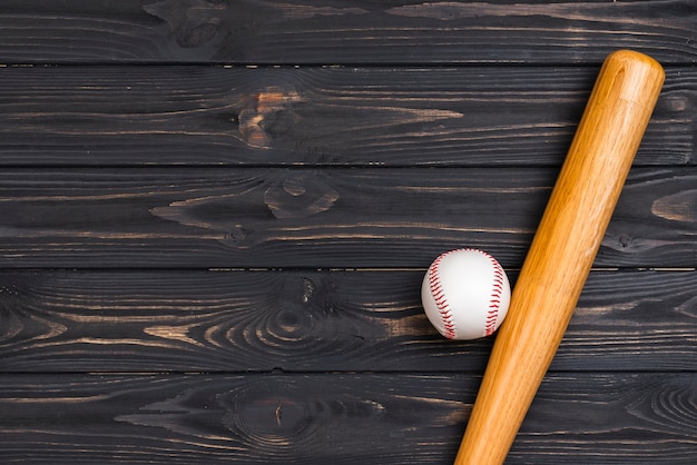 Flat lay of baseball bat and ball