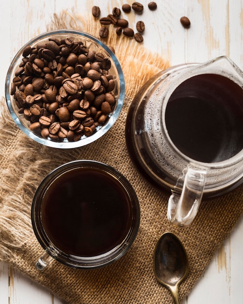 Flat lay black coffee arrangement on cloth