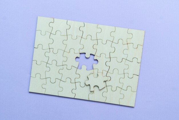 A flat lay of blank puzzle jigsaw, solution and desiciion making concept