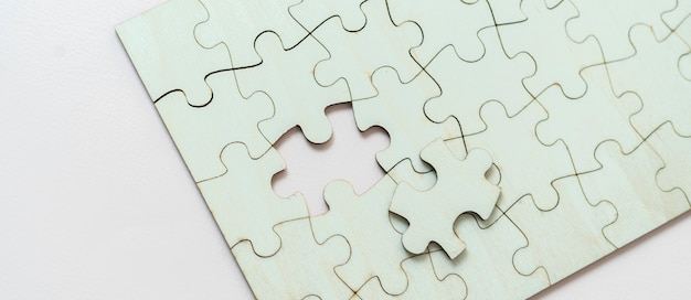 A flat lay of blank puzzle jigsaw, solution and desiciion making concept
