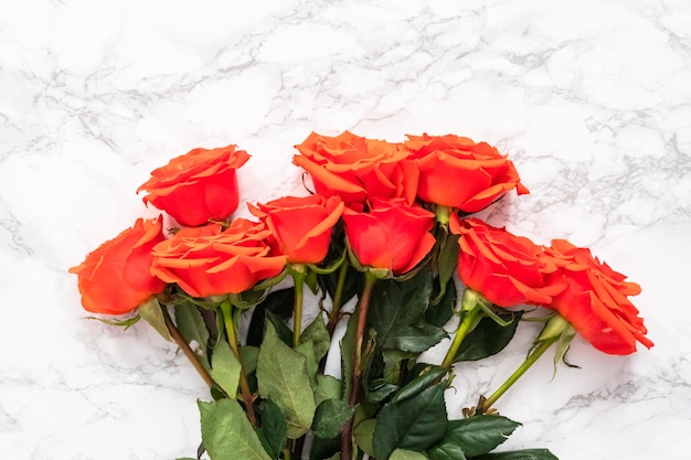 Photo flat lay. bouquet of red on a marble background.