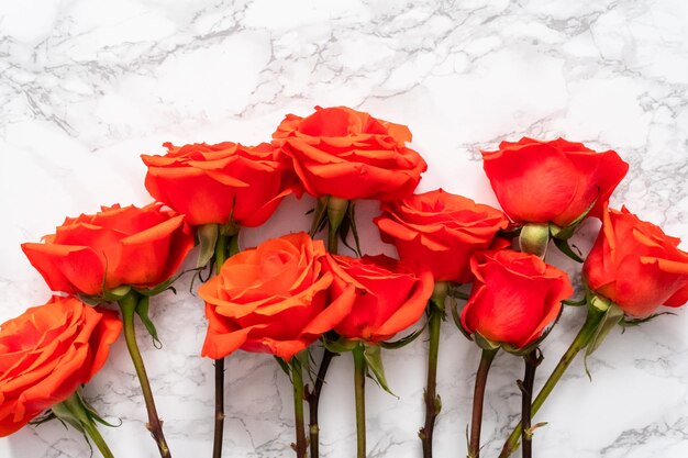 Flat lay. Bouquet of red on a marble background.