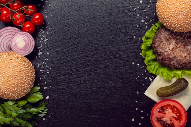 Photo flat lay burger ingredients with copy space