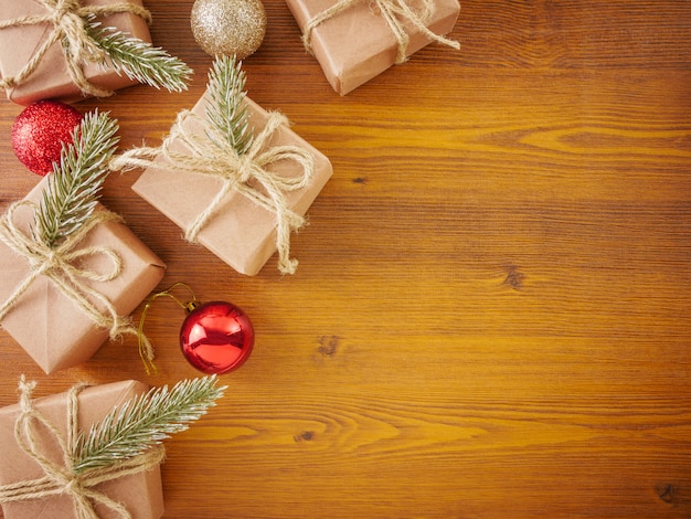 Flat lay Christmas ornaments on wooden background with copy space 