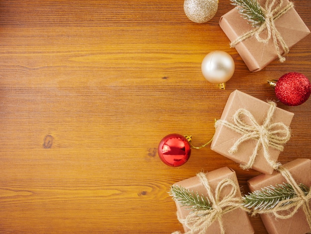 Flat lay Christmas ornaments on wooden background with copy space 