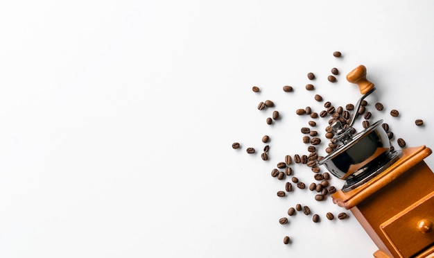 Flat lay of coffee beans and grinder