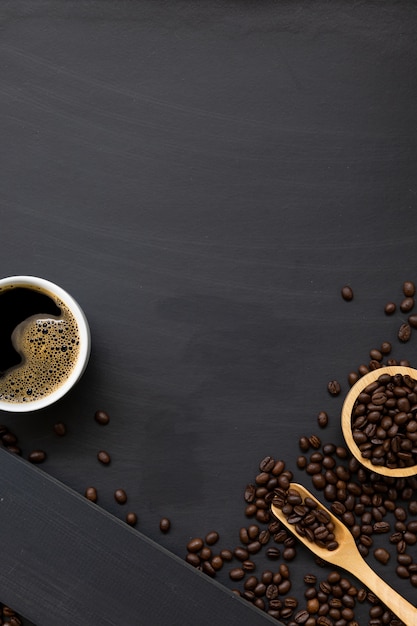 Flat lay of coffee beans and wooden spoon