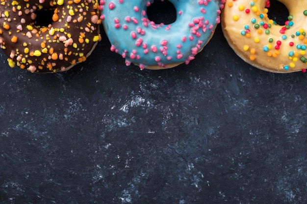 Flat lay of colorful donuts Copyspace