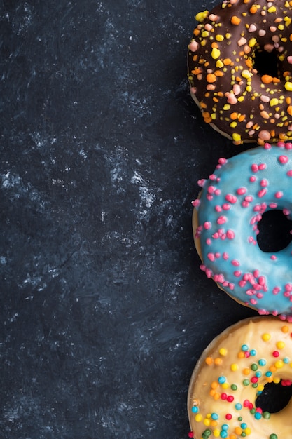 Flat lay of colorful donuts. Donuts background.