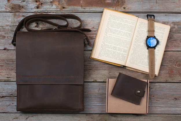 Flat lay composition from the watch, accessories of the made of skin 