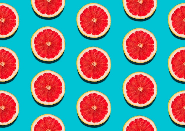 Flat lay composition grapefruit slice close up on blue bright