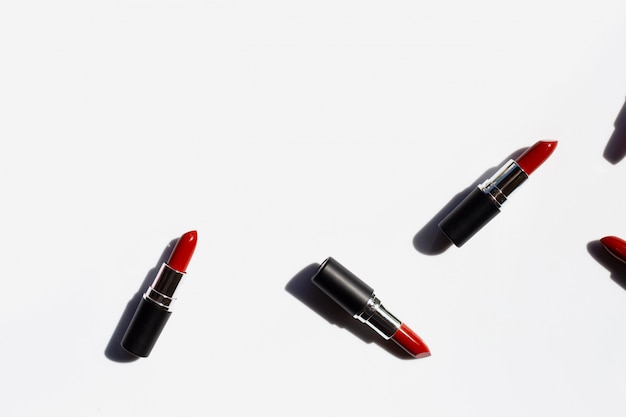 Flat lay composition, Lipsticks on white background with shadow. Beautiful Make-up concept