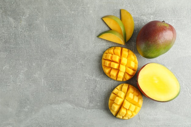 Flat lay composition with cut mangoes