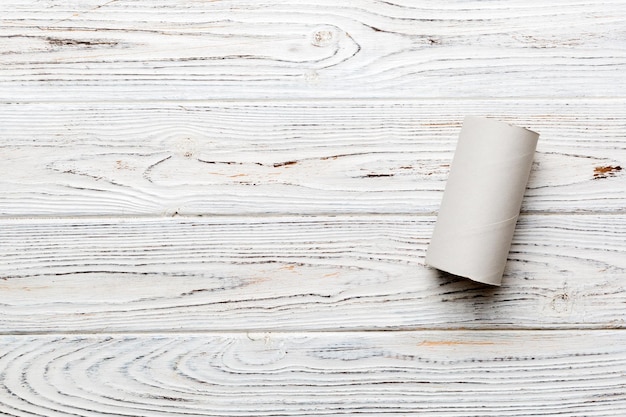 Flat lay composition with empty toilet paper rolls and space for text on color background Recyclable paper tube with metal plug end made of kraft paper or cardboard