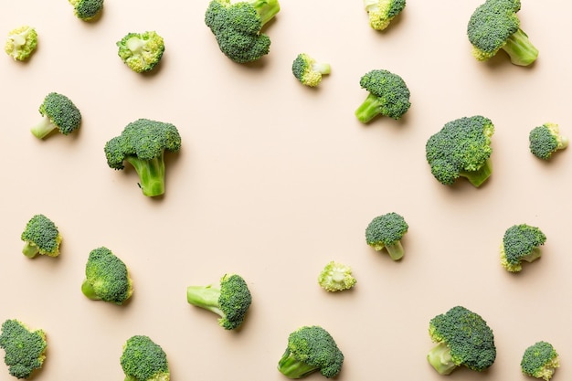 Flat lay composition with fresh green broccoli frame eith copy space on light background