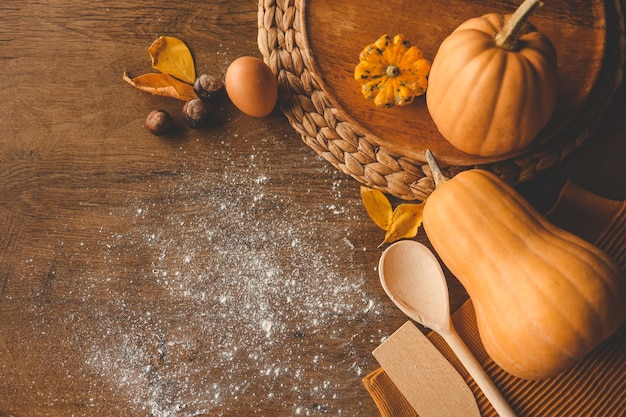 Flat lay composition with ingredients for making pumpkin pie