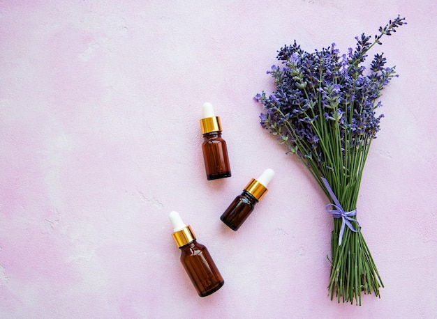 Flat lay composition with lavender flowers and natural cosmetic