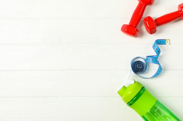 Flat lay composition with loss weigh accessories on white wooden background